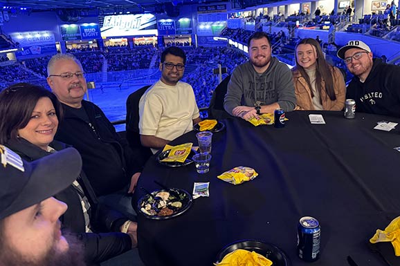 Monroe Environmental employees enjoying dinner before the Walleyes game