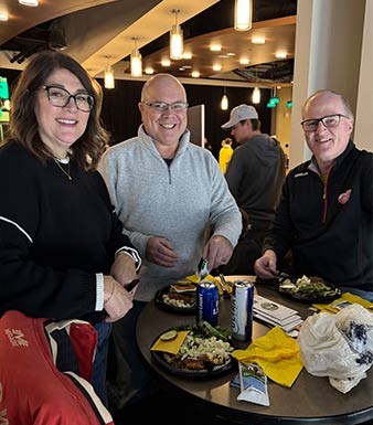 Monroe Environmental employees enjoying dinner before the Toledo Walleyes game